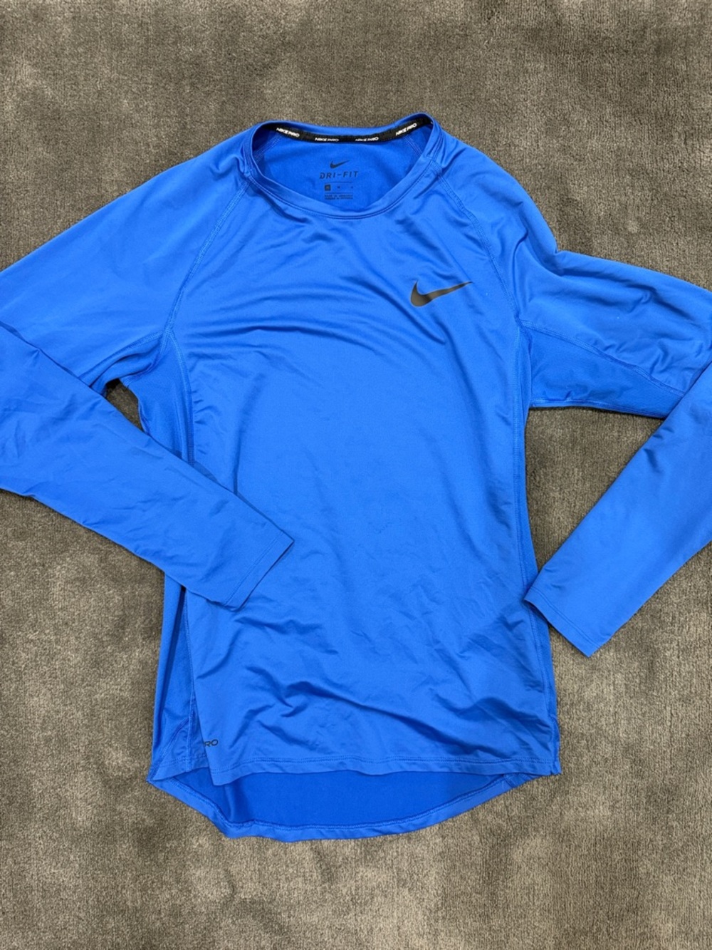 Nike Long Sleeve Dri-FIT Top in Blue with Black Swoosh